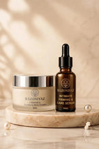 Razo Niyaz body cream 50g and intimate tightening serum 30ml displayed on a marble stand.