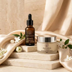 stone steps aur satin wali: Razo Niyaz body cream 50g and intimate serum 30ml on stone steps surrounded by champagne satin and white flowers.