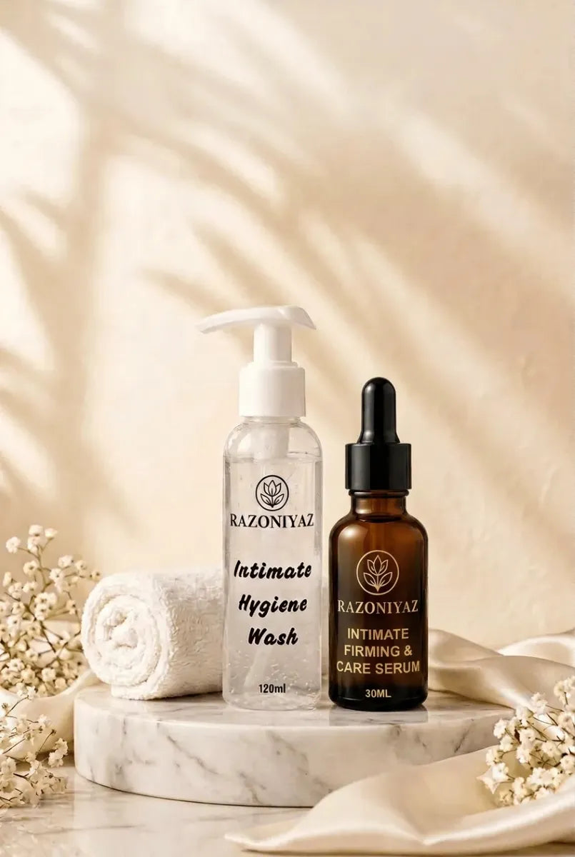 Razoniyaz Intimate Hygiene & Care Routine Kit on marble beside a rolled towel and flowers.